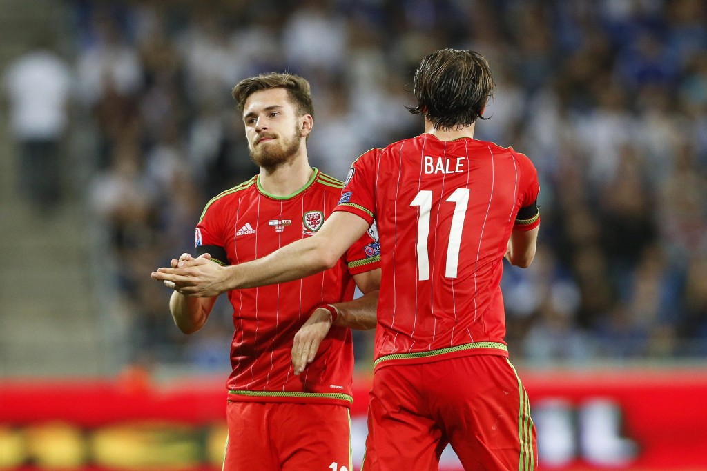 Aaron Ramsey (L) of Wales is congratulated by his teammate Gareth Bale (R) after scoring the 1-0 lead during the UEFA EURO 2016 group B qualifying soccer match between Israel and Wales at Sammy Ofer Stadium in Haifa, Israel, 28 March 2015. (Photo by Abir Sultan/EPA)
