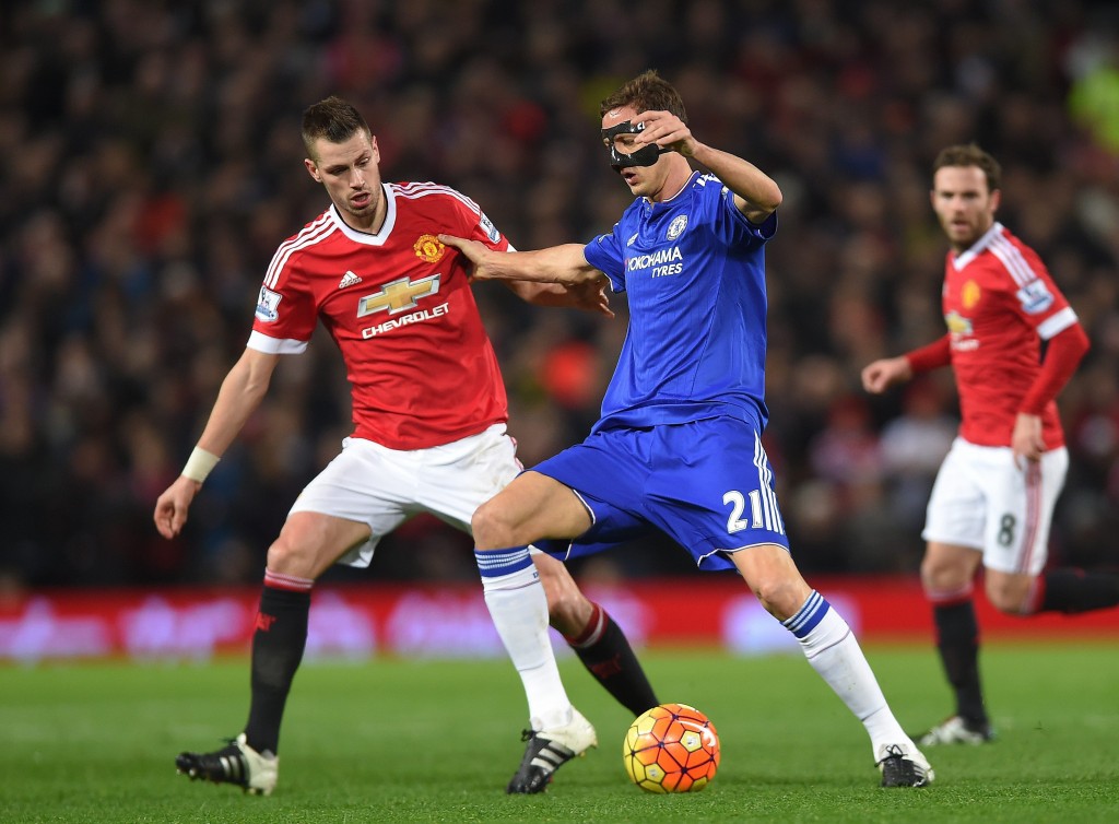 Chelsea's Nemanja Matic (R) in action with Manchester United's Morgan Schneiderlin (L) during the English Premier League soccer match between Manchester United and Chelsea at Old Trafford, Manchester, Britain, 28 December 2015. (Photo by Peter Powell/EPA)
