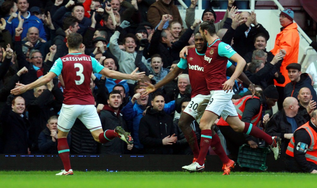 West Ham's Michail Antonio (C) celebrates with team mate Andy Carroll (R) after scoring a goal during the English Premier League soccer match between West Ham and Liverpool at Upton Park in London, Britain, 02 January 2016. (Photo by Sean Dempsey/EPA)