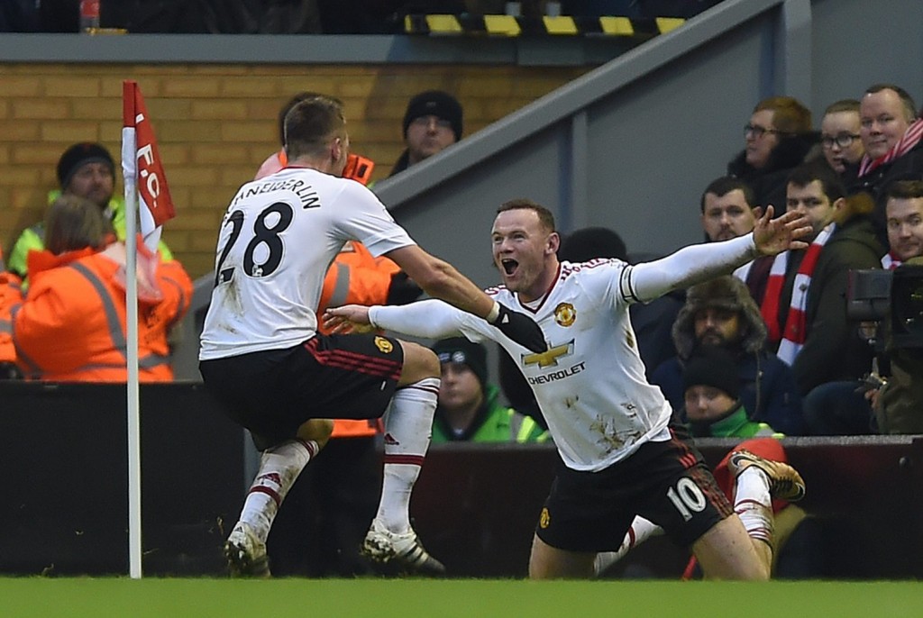 Manchester United's Wayne Rooney (R) is congratulated by Morgan Schneiderlin (L) after scoring the opening goal during the English Premier League soccer match between Liverpool and Manchester United at Anfield, Liverpool, Britain, 17 January 2016. (Photo by Peter Powell/EPA) 