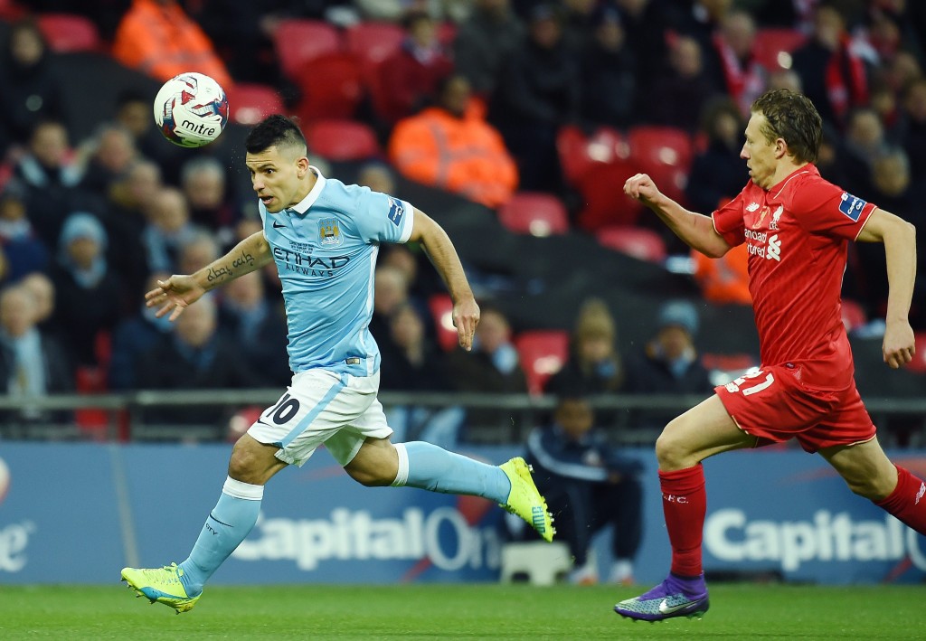 Sergio Aguero (left, in blue) and Lucas Leiva (right, in red) of Manchester City and Liverpool respectively