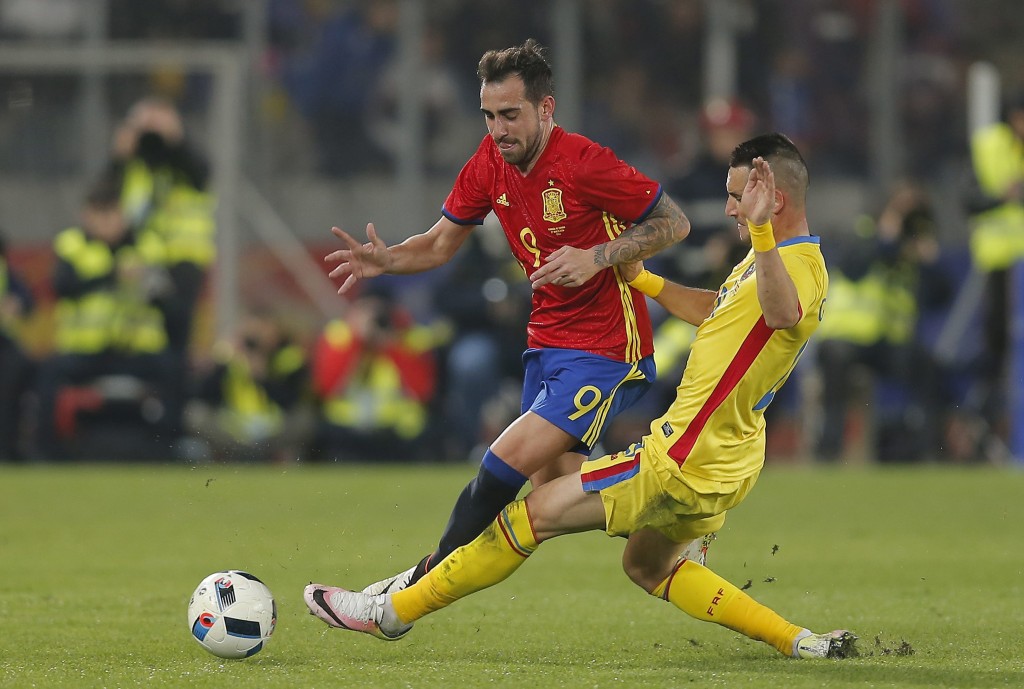 Spain's Paco Alcacer (L) vies for the ball with Romania's Dragos Grigore (R) during the friendly soccer game between Romania and Spain, held at Cluj Arena stadium in Cluj city, 450 Km north-west from Bucharest, Romania, 27 March 2016. EPA/ROBERT GHEMENT