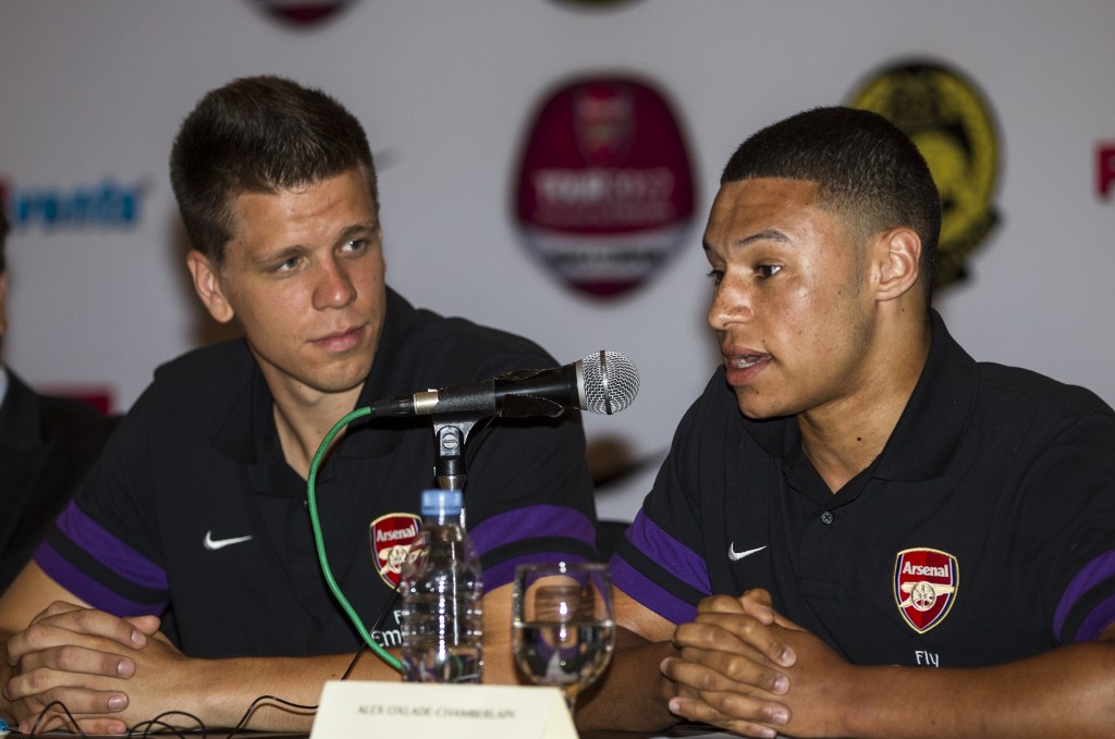 epa03314065 Arsenal's players Wojciech Szczesny (L) and Alex Oxlade-Chamberlain during a media conference in Subang, near Kuala Lumpur, Malaysia, 22 July 2012. Arsenal Football Club wil kick off their first pre-season tour with Malaysian XI team in Kuala Lumpur followed by China and Hong Kong. EPA/AHMAD YUSNI