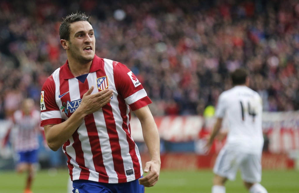 REFILE - WITH ADDITIONAL INFORMATION Atletico Madrid's Jorge "Koke" Resurrecion celebrates his goal against Real Madrid during their Spanish first division soccer match at Vicente Calderon stadium in Madrid March 2, 2014.          REUTERS/Andrea Comas (SPAIN  - Tags: SPORT SOCCER)