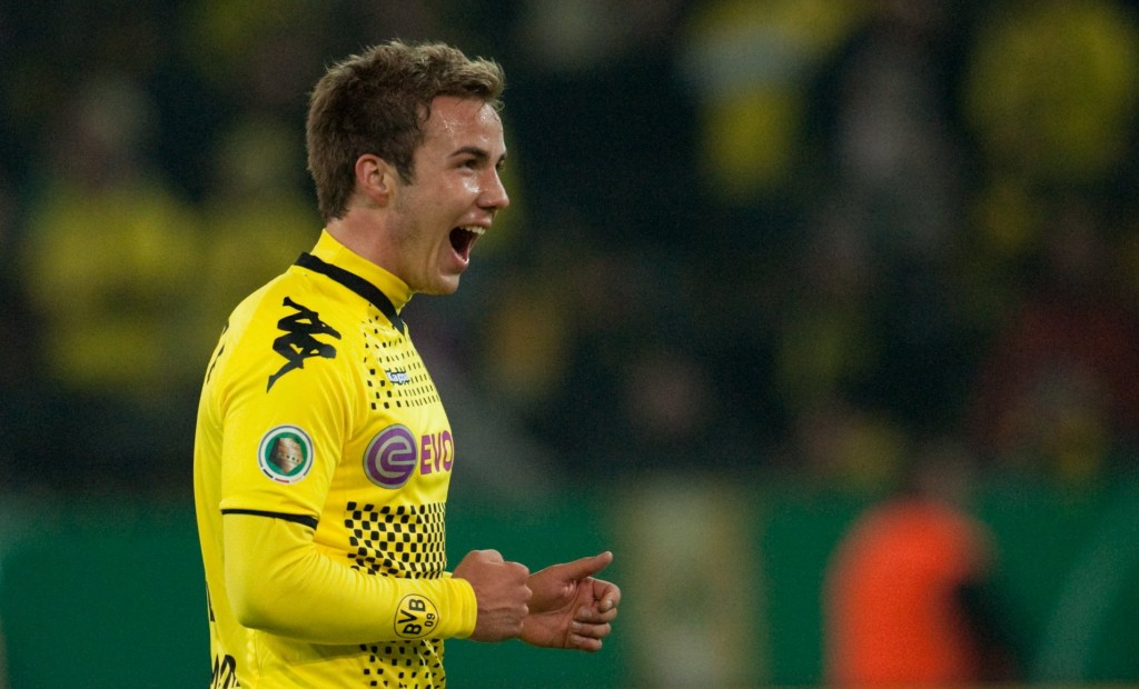 epa02980433 Dortmund's Mario Gotze jubilates after scoring the 2-0 against Dynamo Dresden during the German Cup second round soccer match in Dortmund, Germany, 25 October 2011. (ATTENTION: The DFB prohibits the utilisation and publication of sequential pictures on the internet and other online media during the match (including half-time). ATTENTION: BLOCKING PERIOD! The DFB permits the further utilisation and publication of the pictures for mobile services (especially MMS) and for DVB-H and DMB only two hours after the end of the match.) EPA/BERND THISSEN