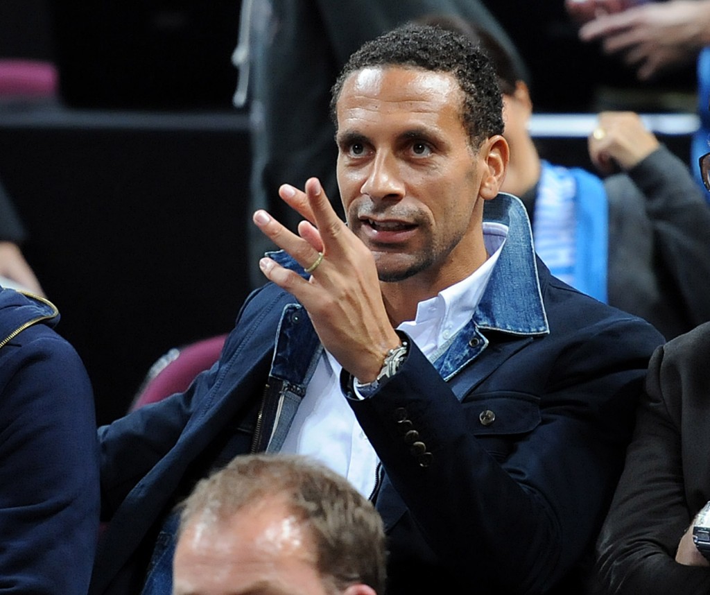 epa03902567 Manchester United's Rio Ferdinand enjoys the action during a NBA Pre Season match between Oklahoma City Thunder and Philadelphia 76ers at the Phone 4u Arena in Manchester, Britain, 08 October 2013. EPA/PETER POWELL
