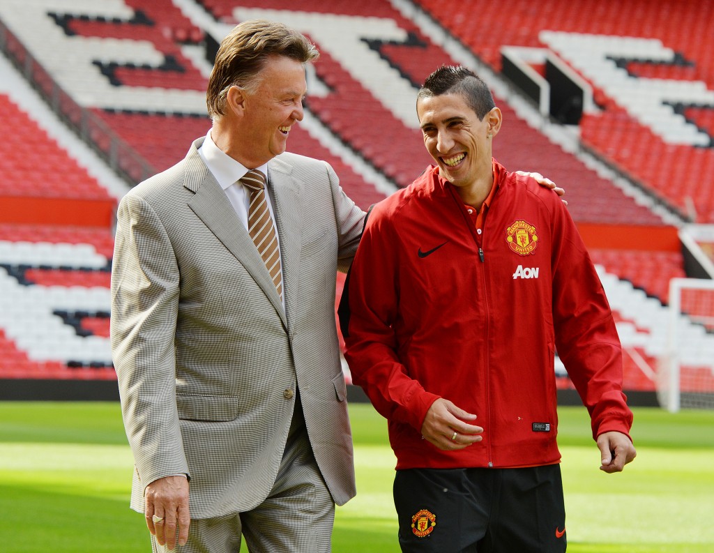 epaselect epa04372208 Manchester United winger Angel Di Maria (R) walks along the pitch at Old Trafford with Manchester United manager Louis van Gaal after agreeing a British record transfer fee of 75 million ? from Real Madrid at Old Trafford, Manchester, Britain, 28 August 2014. EPA/PETER POWELL