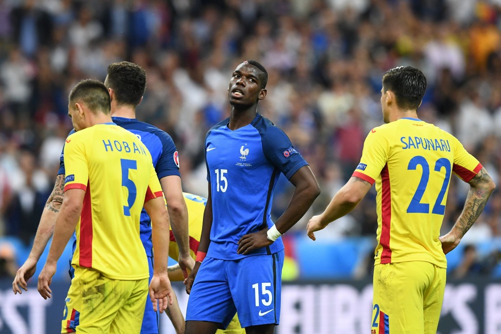 France's midfielder Paul Pogba (C) reacts during the Euro 2016 group A football match between France and Romania at Stade de France, in Saint-Denis, north of Paris, on June 10, 2016. / AFP / FRANCK FIFE (Photo credit should read FRANCK FIFE/AFP/Getty Images)