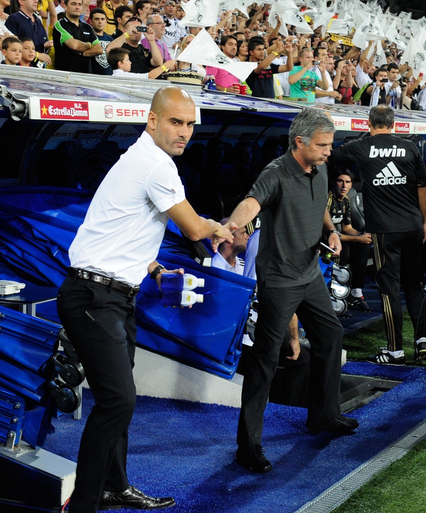Barcelona's coach Josep Guardiola (L) and Real Madrid's Portuguese coach Jose Mourinho shake hands before the Spanish Supercup first leg football match between Real Madrid and Barcelona at the Santiago Bernabeu stadium in Madrid on August 14, 2011. AFP PHOTO/ DANI POZO (Photo credit should read DANI POZO/AFP/Getty Images)