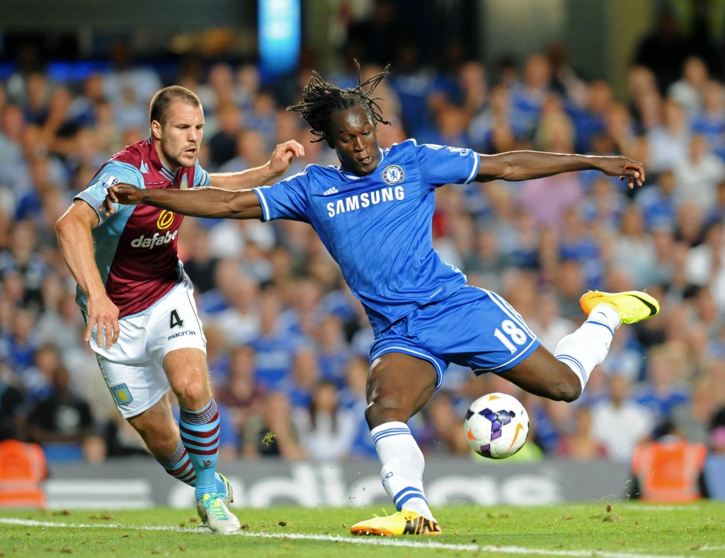 Chelsea's Belgian striker Romelu Lukaku (R) vies with Aston Villa's Dutch defender Ron Vlaar (L) during the English Premier League football match between Chelsea and Aston Villa at Stamford Bridge in London on August 21, 2013. Chelsea won the game 2-1. AFP PHOTO/OLLY GREENWOOD RESTRICTED TO EDITORIAL USE. NO USE WITH UNAUTHORIZED AUDIO, VIDEO, DATA, FIXTURE LISTS, CLUB/LEAGUE LOGOS OR LIVE SERVICES. ONLINE IN-MATCH USE LIMITED TO 45 IMAGES, NO VIDEO EMULATION. NO USE IN BETTING, GAMES OR SINGLE CLUB/LEAGUE/PLAYER PUBLICATIONS. (Photo credit should read OLLY GREENWOOD/AFP/Getty Images)