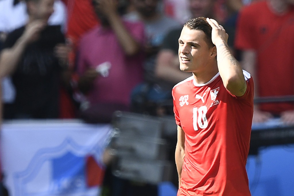 Switzerland's midfielder Granit Xhaka reacts after missing a penalty during the Euro 2016 round of sixteen football match Switzerland vs Poland, on June 25, 2016 at the Geoffroy Guichard stadium in Saint-Etienne. / AFP / MARTIN BUREAU (Photo credit should read MARTIN BUREAU/AFP/Getty Images)