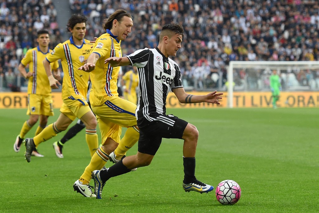 TURIN, ITALY - MAY 14: Paulo Dybala (R) of Juventus FC is challenged by Edgar Osvaldo Barreto of UC Sampdoria during the Serie A match between Juventus FC and UC Sampdoria at Juventus Arena on May 14, 2016 in Turin, Italy. (Photo by Valerio Pennicino/Getty Images)