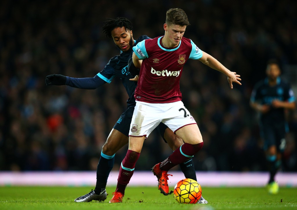 LONDON, ENGLAND - JANUARY 23: Sam Byram of West Ham United holds off Raheem Sterling of Manchester City during the Barclays Premier League match between West Ham United and Manchester City at the Boleyn Ground on January 23, 2016 in London, England. (Photo by Paul Gilham/Getty Images)