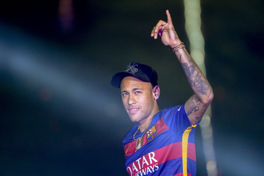 TOPSHOT - Barcelona's Brazilian forward Neymar acknowledges the crowd during celebrations at the Camp Nou stadium in Barcelona on May 23, 2016 following their Spanish "Copa del Rey" (King's Cup) final football match 2-0 victory over Sevilla FC yesterday also marking the club's 28th Copa del Rey win and the 24th Spanish Liga title. / AFP / JOSEP LAGO (Photo credit should read JOSEP LAGO/AFP/Getty Images)