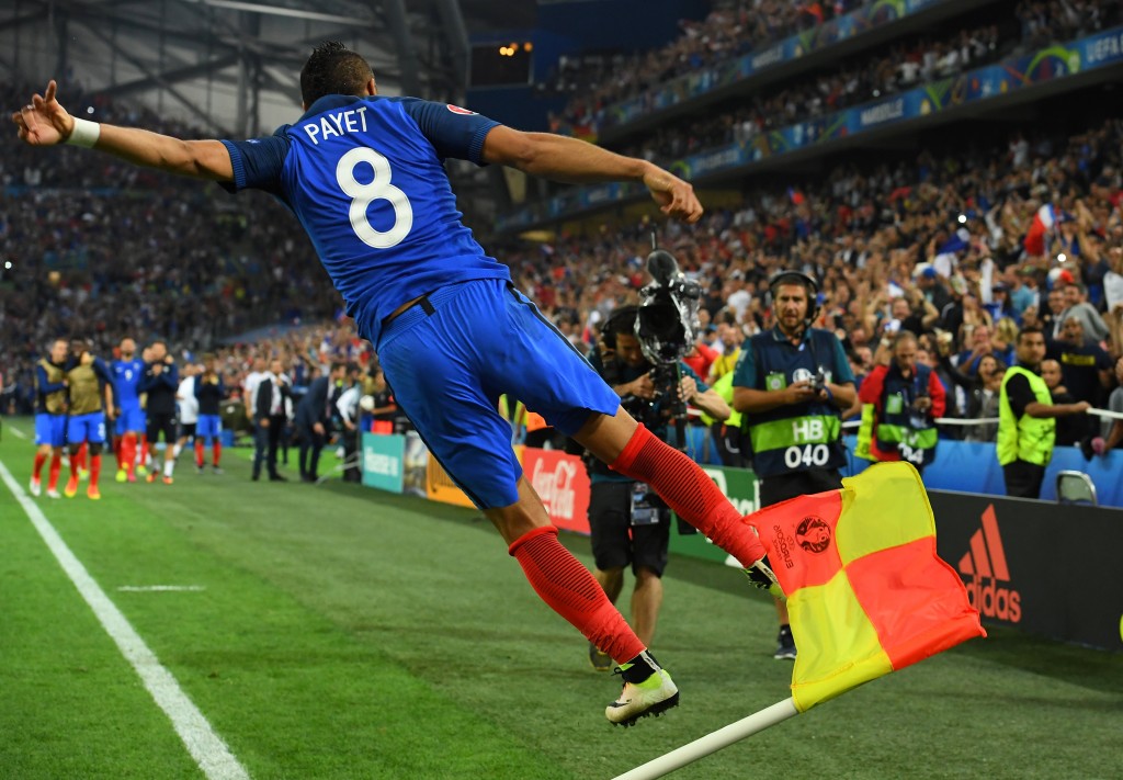 France's forward Dimitri Payet jumps in the air as he celebrates scoring a second goal for France during the Euro 2016 group A football match between France and Albania at the Velodrome stadium in Marseille on June 15, 2016. / AFP / FRANCK FIFE (Photo credit should read FRANCK FIFE/AFP/Getty Images)