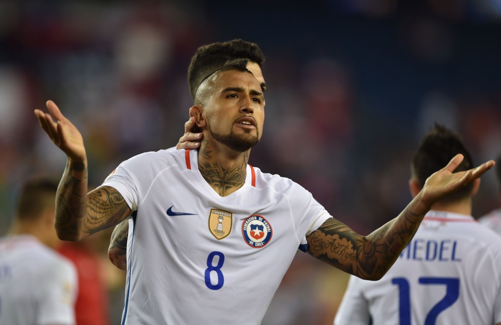 Chile's Arturo Vidal celebrates after scoring a penalty against Bolivia during the Copa America Centenario football tournament in Foxborough, Massachusetts, United States, on June 10, 2016. / AFP / Hector RETAMAL (Photo credit should read HECTOR RETAMAL/AFP/Getty Images)