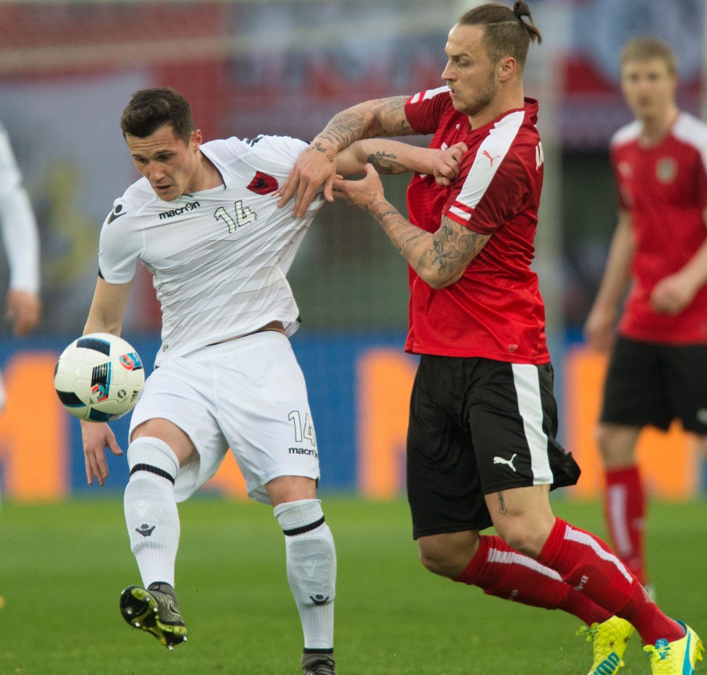 Marko Arnautovic (R) of Austria and Taulant Xhaka of Albania vie for a ball during the friendly football match between Austria and Albania in the Ernst-Happel stadium in Vienna, on March 26, 2016. / AFP / JOE KLAMAR (Photo credit should read JOE KLAMAR/AFP/Getty Images)