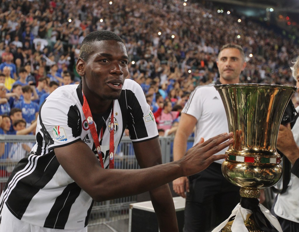 ROME, ITALY - MAY 21: Paul Pogba of Juventus FC celebrates with the trophy after winning the TIM Cup final match against AC Milan at Stadio Olimpico on May 21, 2016 in Rome, Italy. (Photo by Paolo Bruno/Getty Images)