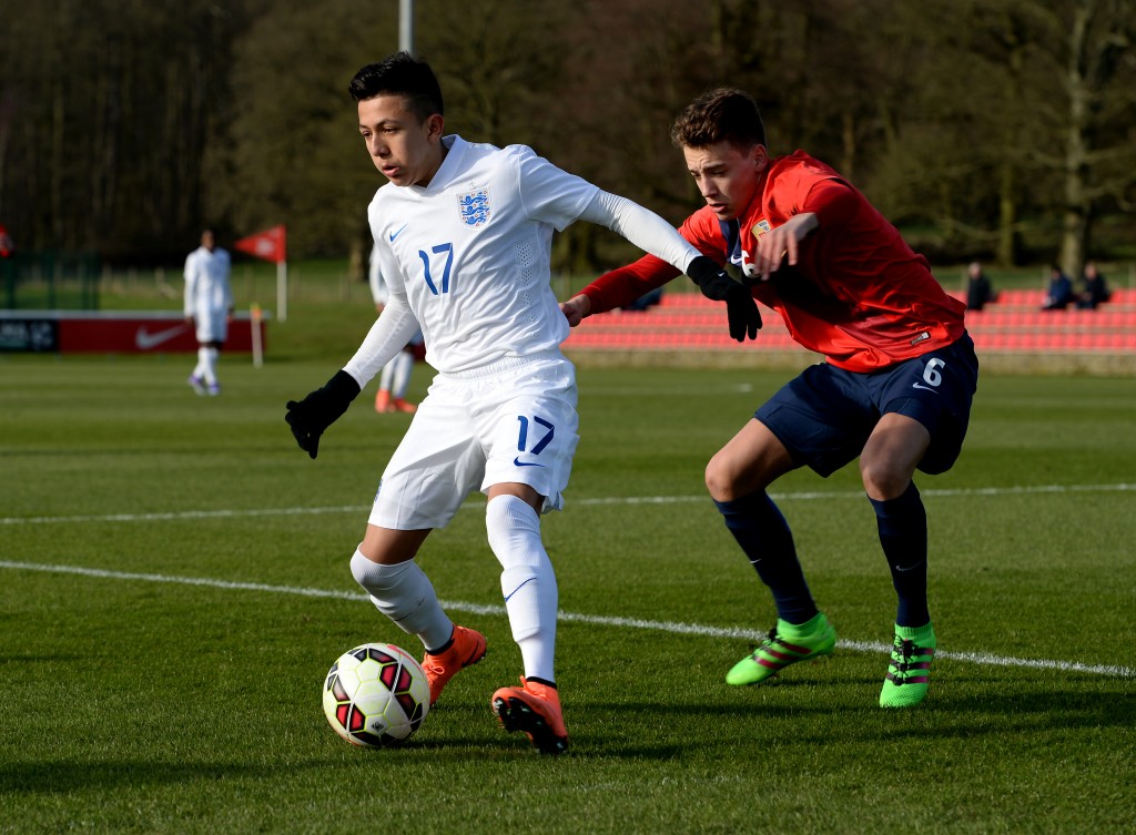 BURTON-UPON-TRENT, ENGLAND - FEBRUARY 16: Ian Carlo Poveda of England U16 holds off a challenge from Erik Tobias Sandberg of Norway U16 during the U16s International Friendly match between England U16 and Norway U16 at St Georges Park on February 16, 2016 in Burton-upon-Trent, England. (Photo by Tony Marshall/Getty Images)