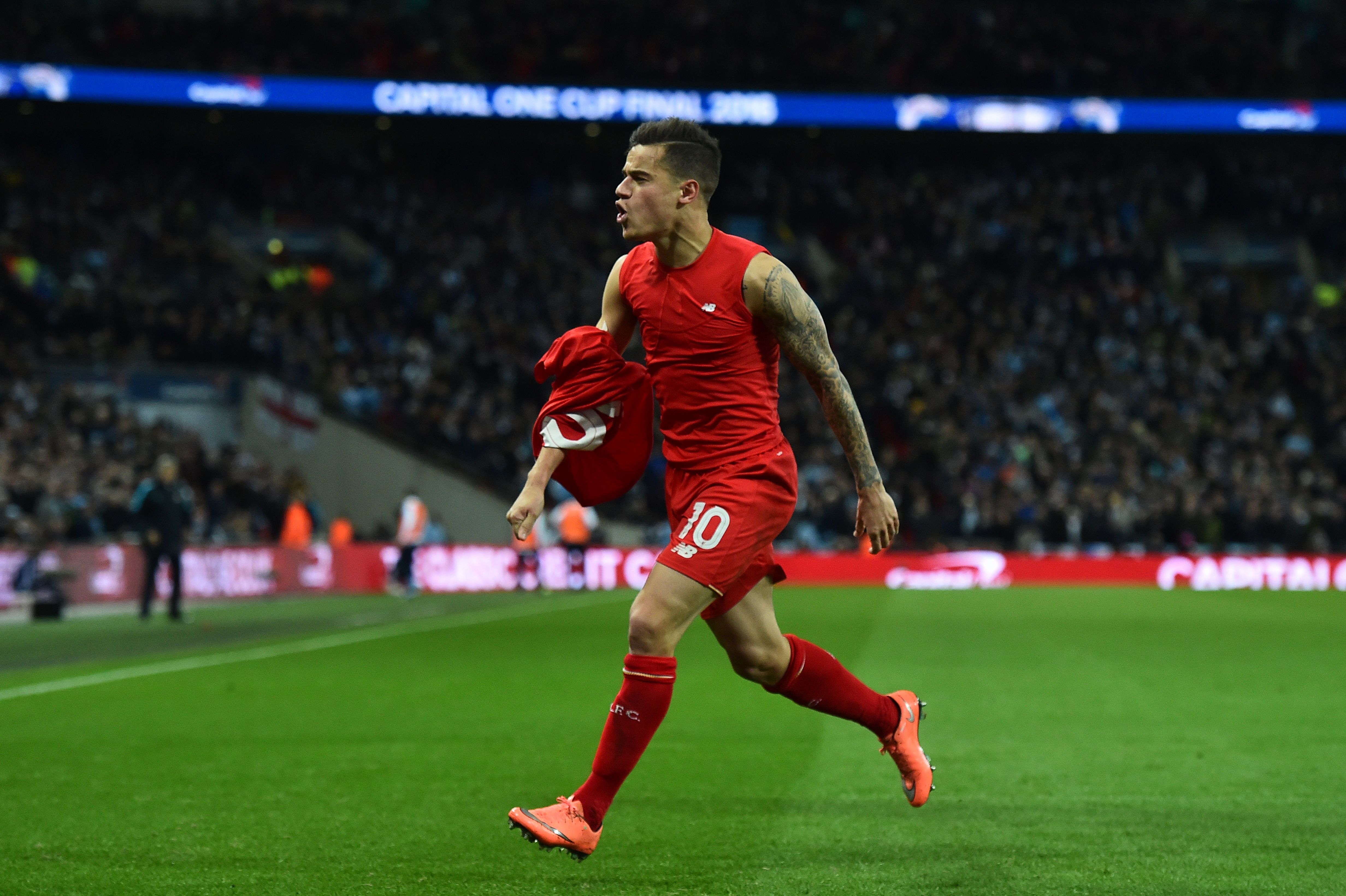 Liverpool's Brazilian midfielder Philippe Coutinho celebrates scoring their first goal to equalise 1-1 during the English League Cup final football match between Liverpool and Manchester City at Wembley Stadium in London on February 28, 2016. / AFP / BEN STANSALL / RESTRICTED TO EDITORIAL USE. No use with unauthorized audio, video, data, fixture lists, club/league logos or 'live' services. Online in-match use limited to 75 images, no video emulation. No use in betting, games or single club/league/player publications. / (Photo credit should read BEN STANSALL/AFP/Getty Images)