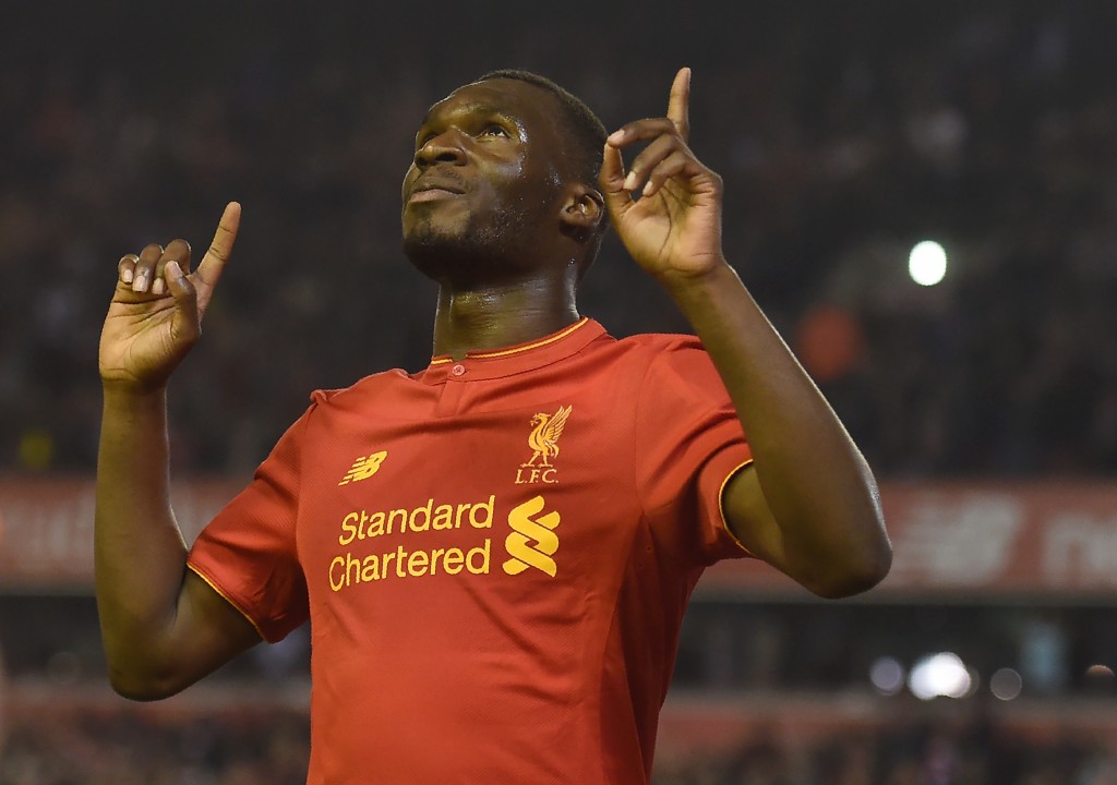 Liverpool's Christian Benteke celebrates after scoring his team's first goal during the English Premier League football match between Liverpool and Chelsea at Anfield in Liverpool, north west England on May 11, 2016. / AFP / PAUL ELLIS / RESTRICTED TO EDITORIAL USE. No use with unauthorized audio, video, data, fixture lists, club/league logos or 'live' services. Online in-match use limited to 75 images, no video emulation. No use in betting, games or single club/league/player publications. / (Photo credit should read PAUL ELLIS/AFP/Getty Images)