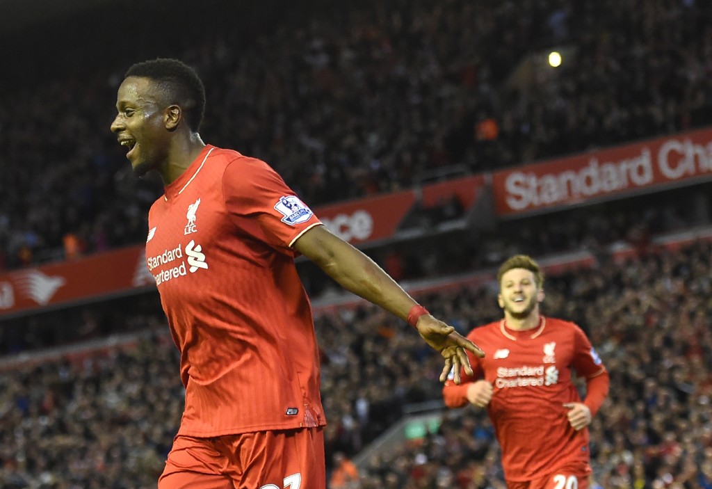 Liverpool's Belgian striker Divock Origi (L) celebrates after scoring during the English Premier League football match between Liverpool and Everton at Anfield in Liverpool, north west England on April 20, 2016. / AFP / PAUL ELLIS / RESTRICTED TO EDITORIAL USE. No use with unauthorized audio, video, data, fixture lists, club/league logos or 'live' services. Online in-match use limited to 75 images, no video emulation. No use in betting, games or single club/league/player publications. / (Photo credit should read PAUL ELLIS/AFP/Getty Images)
