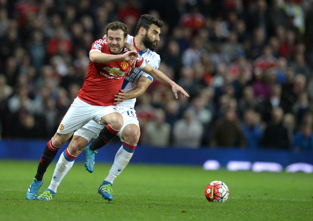 Manchester United's Spanish midfielder Juan Mata (L) is fouled by Crystal Palace's Australian midfielder Mile Jedinak during the English Premier League football match between Manchester United and Crystal Palace at Old Trafford in Manchester, north west England, on April 20, 2016. / AFP / OLI SCARFF / RESTRICTED TO EDITORIAL USE. No use with unauthorized audio, video, data, fixture lists, club/league logos or 'live' services. Online in-match use limited to 75 images, no video emulation. No use in betting, games or single club/league/player publications. / (Photo credit should read OLI SCARFF/AFP/Getty Images)
