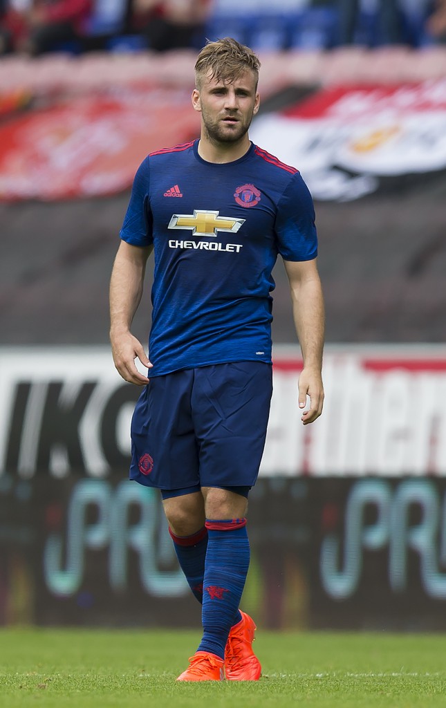 Manchester United's English defender Luke Shaw is pictured during the pre-season friendly football match between Wigan Athletic and Manchester United at the DW stadium in Wigan, northwest England, on July 16, 2016. / AFP / JON SUPER / RESTRICTED TO EDITORIAL USE. No use with unauthorized audio, video, data, fixture lists, club/league logos or 'live' services. Online in-match use limited to 75 images, no video emulation. No use in betting, games or single club/league/player publications. / (Photo credit should read JON SUPER/AFP/Getty Images)