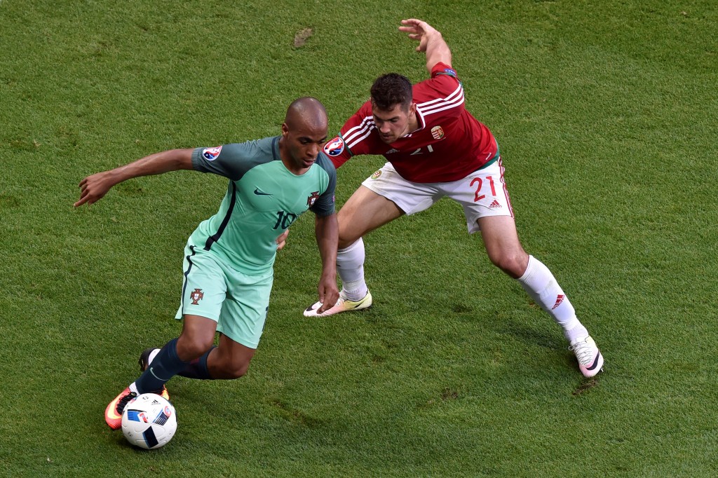 Portugal's midfielder Joao Mario (L) vies with Hungary's defender Barnabas Bese during the Euro 2016 group F football match between Hungary and Portugal at the Parc Olympique Lyonnais stadium in Decines-Charpieu, near Lyon, on June 22, 2016. / AFP / JEAN-PHILIPPE KSIAZEK (Photo credit should read JEAN-PHILIPPE KSIAZEK/AFP/Getty Images)