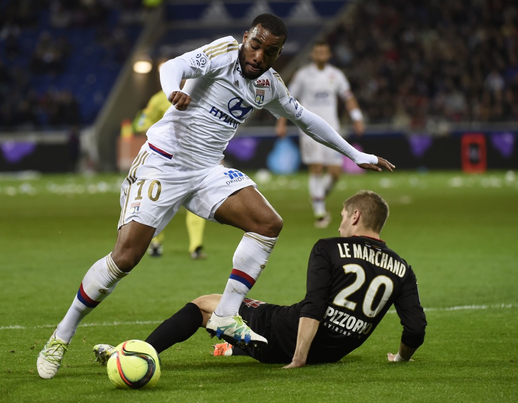 Lyon's French forward Alexandre Lacazette (R) vies with Nice's French defender Maxime Le Marchand (L) during the French L1 football match Olympique Lyonnais and OGC Nice on April 15, 2016, at the New Stadium in Decines-Charpieu near Lyon, southeastern France. AFP PHOTO/PHILIPPE DESMAZES / AFP / PHILIPPE DESMAZES (Photo credit should read PHILIPPE DESMAZES/AFP/Getty Images)