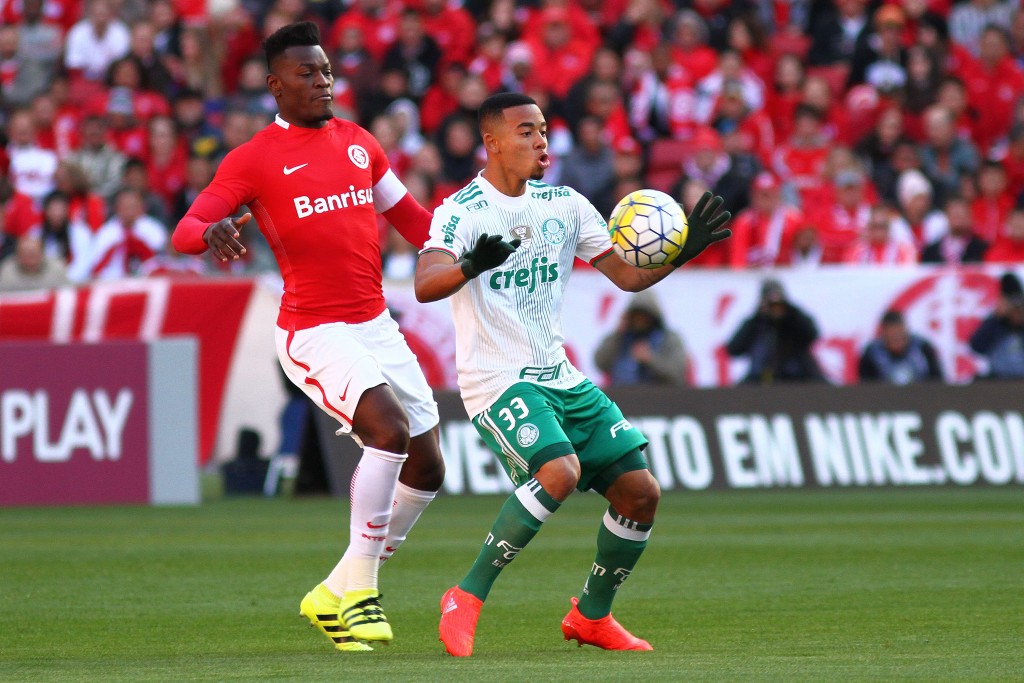 PORTO ALEGRE, BRAZIL - JULY 17: Paulao of Internacional battles for the ball against Gabriel Jesus of Palmeiras during the match between Internacional and Palmeiras as part of Brasileirao Series A 2016, at Estadio Beira-Rio on July 17, 2016, in Porto Alegre, Brazil. (Photo by Lucas Uebel/Getty Images)