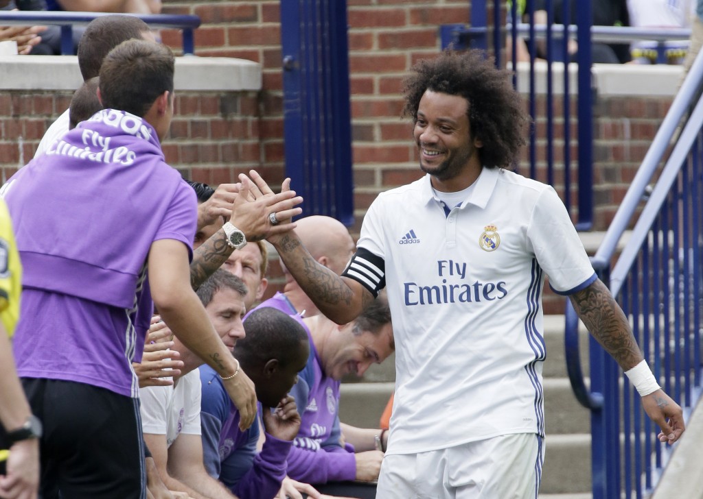 ANN ARBOR, MI - JULY 30: Marcelo Vieira Da Silva #12 of Real Madrid is congratulated after scoring a goal against Chelsea during the first half at Michigan Stadium on July 30, 2016 in Ann Arbor, Michigan. (Photo by Duane Burleson/Getty Images)