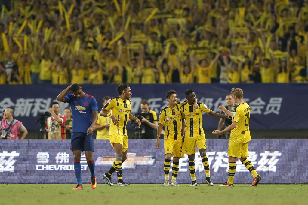 SHANGHAI, CHINA - JULY 22: Ousmane Dembele celebrates with teammates after scoring their second goal during the International Champions Cup match between Manchester United and Borussia Dortmund at Shanghai Stadium on July 22, 2016 in Shanghai, China. (Photo by Lintao Zhang/Getty Images)