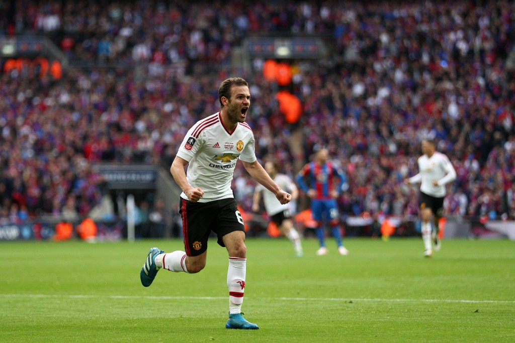 LONDON, ENGLAND - MAY 21: Juan Mata of Manchester United (L) celebrates as he scores their first goal during The Emirates FA Cup Final match between Manchester United and Crystal Palace at Wembley Stadium on May 21, 2016 in London, England. (Photo by Paul Gilham/Getty Images)