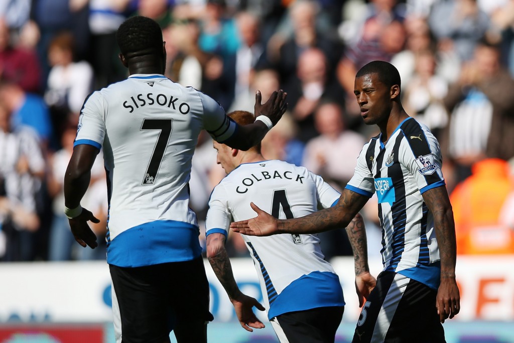 NEWCASTLE UPON TYNE, ENGLAND - MAY 15: Georginio Wijnaldum (R) of Newcastle United celebrates scoring his team's third goal with his team mate Moussa Sissoko during the Barclays Premier League match between Newcastle United and Tottenham Hotspur at St James' Park on May 15, 2016 in Newcastle, England. (Photo by Ian MacNicol/Getty Images)