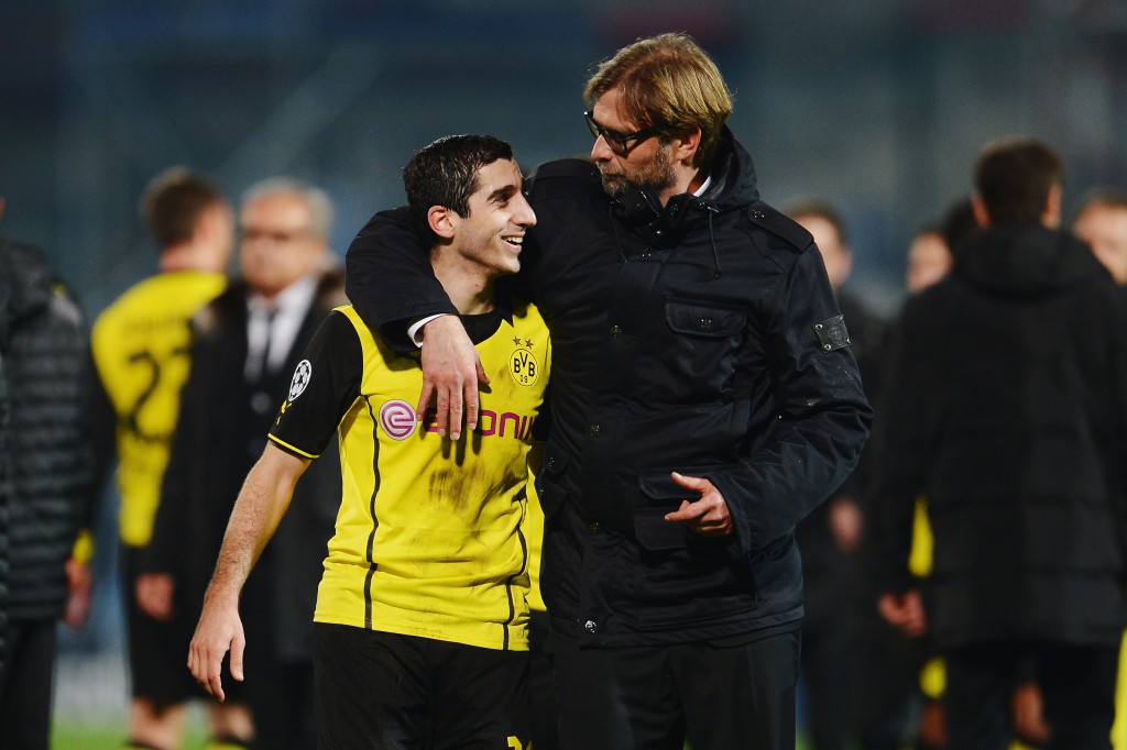 MARSEILLE, FRANCE - DECEMBER 11: Head coach Juergen Klopp of Borussia Dortmund celebrates with Henrikh Mkhitaryan after the UEFA Champions League Group F match between Olympique de Marseille and Borussia Dortmund at Stade Velodrome on December 11, 2013 in Marseille, France. (Photo by Dennis Grombkowski/Bongarts/Getty Images)