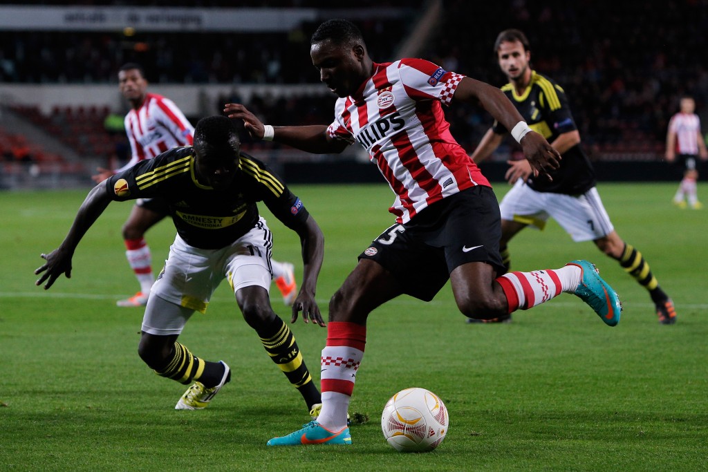 EINDHOVEN, NETHERLANDS - OCTOBER 25: Jetro Willems of PSV and Lalawele Atakora of AIK battle for the ball during the UEFA Europa League Group F match between PSV Eindhoven and AIK Solna at the Philips Stadion on October 25, 2012 in Eindhoven, Netherlands. (Photo by Dean Mouhtaropoulos/Getty Images)