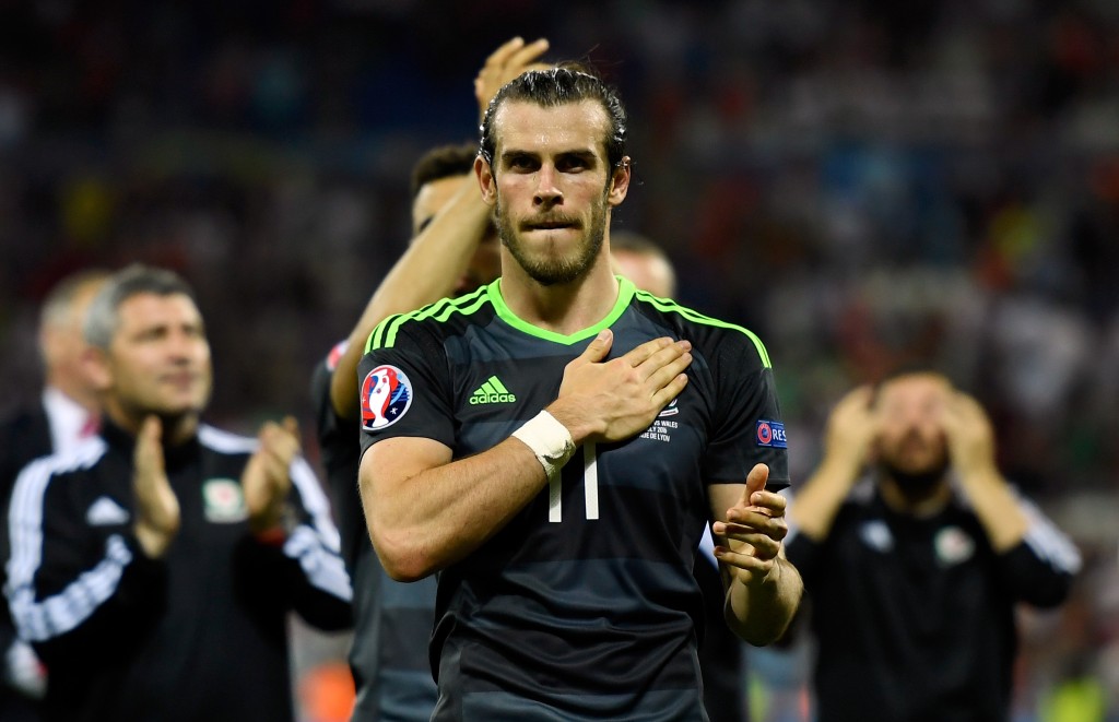 LYON, FRANCE - JULY 06: Gareth Bale of Wales applauds the fas after defeat in the UEFA EURO 2016 semi final match between Portugal and Wales at Stade des Lumieres on July 6, 2016 in Lyon, France. (Photo by Mike Hewitt/Getty Images)