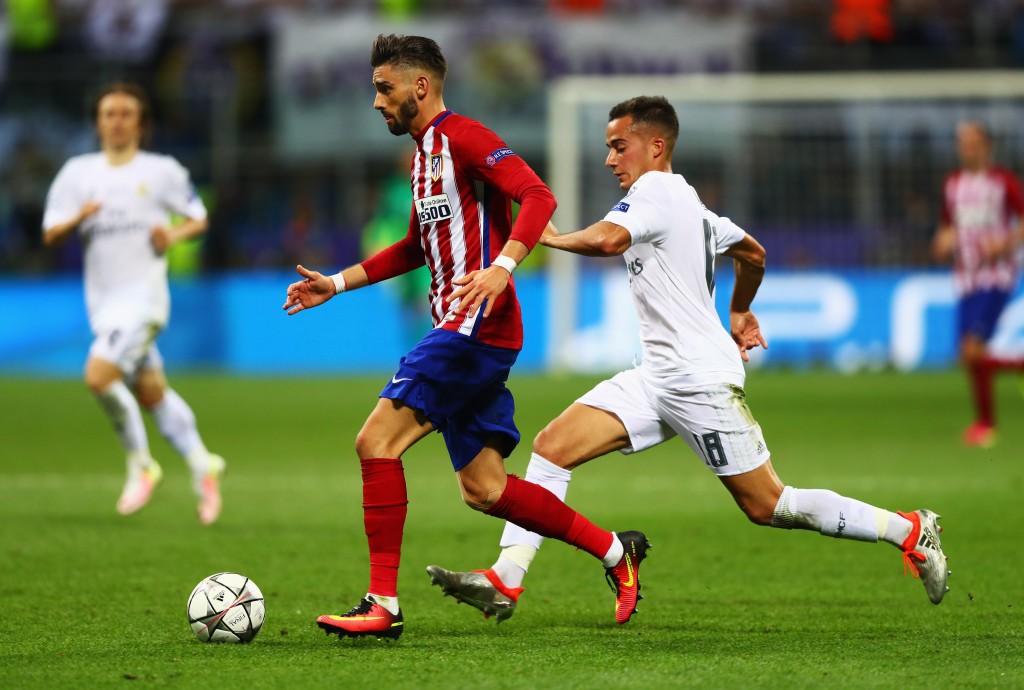 MILAN, ITALY - MAY 28: Yannick Carrasco of Atletico Madrid is chased by Lucas Vazquez of Real Madrid during the UEFA Champions League Final match between Real Madrid and Club Atletico de Madrid at Stadio Giuseppe Meazza on May 28, 2016 in Milan, Italy. (Photo by Clive Rose/Getty Images)