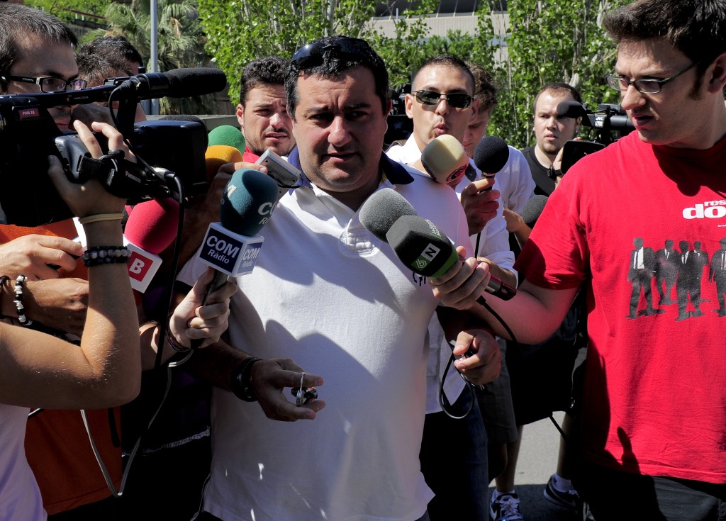Representative for Barcelona's Swedish forward Zlatan Ibrahimovic, Mino Raiola (C), arrives at the offices of Barcelona FC allegedly to sign Ibrahimovic, in Barcelona on August 26, 2010. Swedish forward Zlatan Ibrahimovic revealed that his Barcelona boss Pep Guardiola hardly ever speaks to him as rumours linking him with a move to AC Milan gathered pace. AFP PHOTO / JOSEP LAGO (Photo credit should read JOSEP LAGO/AFP/Getty Images)