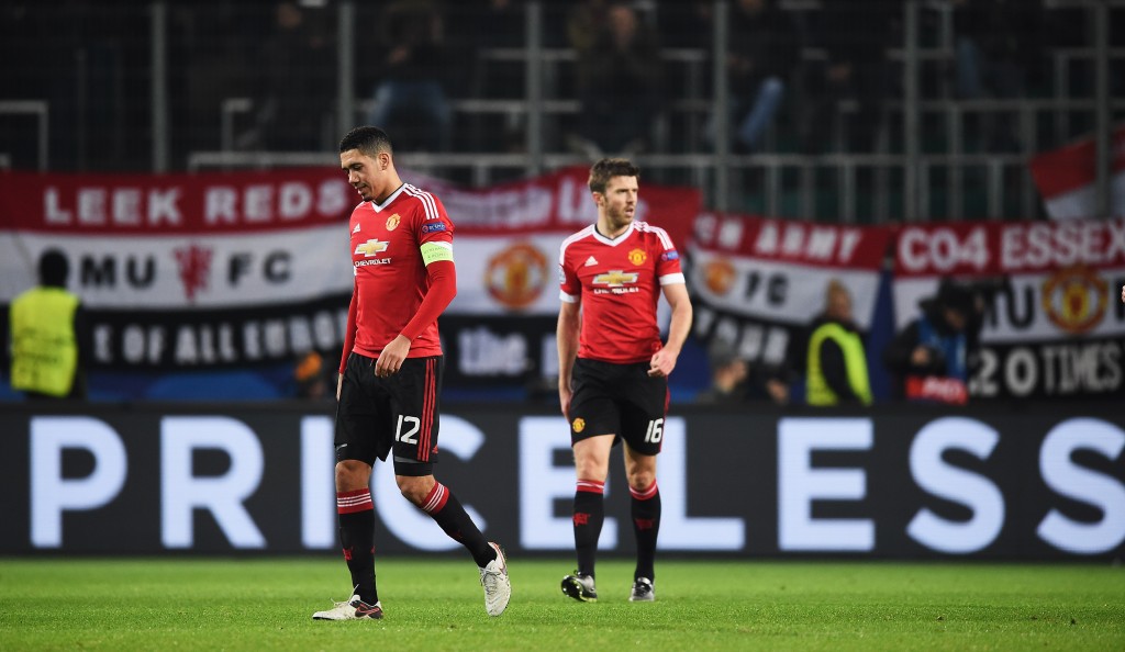 WOLFSBURG, GERMANY - DECEMBER 08: Chris Smalling and Michael Carrick of Manchester look dejected during the UEFA Champions League match between VfL Wolfsburg and Manchester United FC at the Volkswagen arena on December 8, 2015 in Wolfsburg, Germany. (Photo by Stuart Franklin/Bongarts/Getty Images)