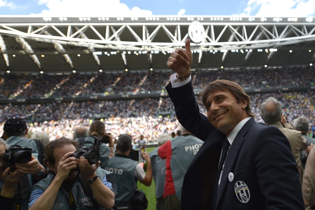 TURIN, ITALY - MAY 18: Juventus FC head coach Antonio Conte salutes during the Serie A match between Juventus and Cagliari Calcio at Juventus Arena on May 18, 2014 in Turin, Italy. (Photo by Valerio Pennicino/Getty Images)