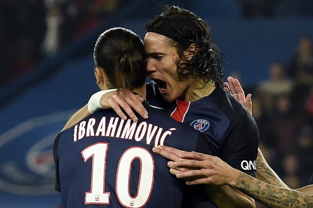 Paris Saint-Germain's Uruguayan forward Edinson Cavani celebrates with Paris Saint-Germain's Swedish forward Zlatan Ibrahimovic (L) after scoring his team's second goal during the French L1 football match between Paris Saint-Germain (PSG) and Saint-Etienne at the Parc des Princes stadium in Paris on October 25, 2015. AFP PHOTO / MIGUEL MEDINA (Photo credit should read MIGUEL MEDINA/AFP/Getty Images)