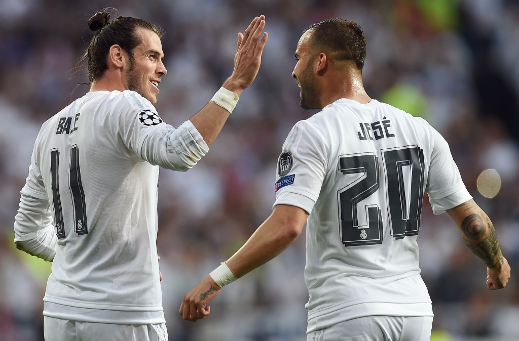 Real Madrid's Welsh forward Gareth Bale (L) celebrates with Real Madrid's forward Jese Rodriguez at the end of the UEFA Champions League semi-final second leg football match Real Madrid CF vs Manchester City FC at the Santiago Bernabeu stadium in Madrid, on May 4, 2016. / AFP / PAUL ELLIS (Photo credit should read PAUL ELLIS/AFP/Getty Images)