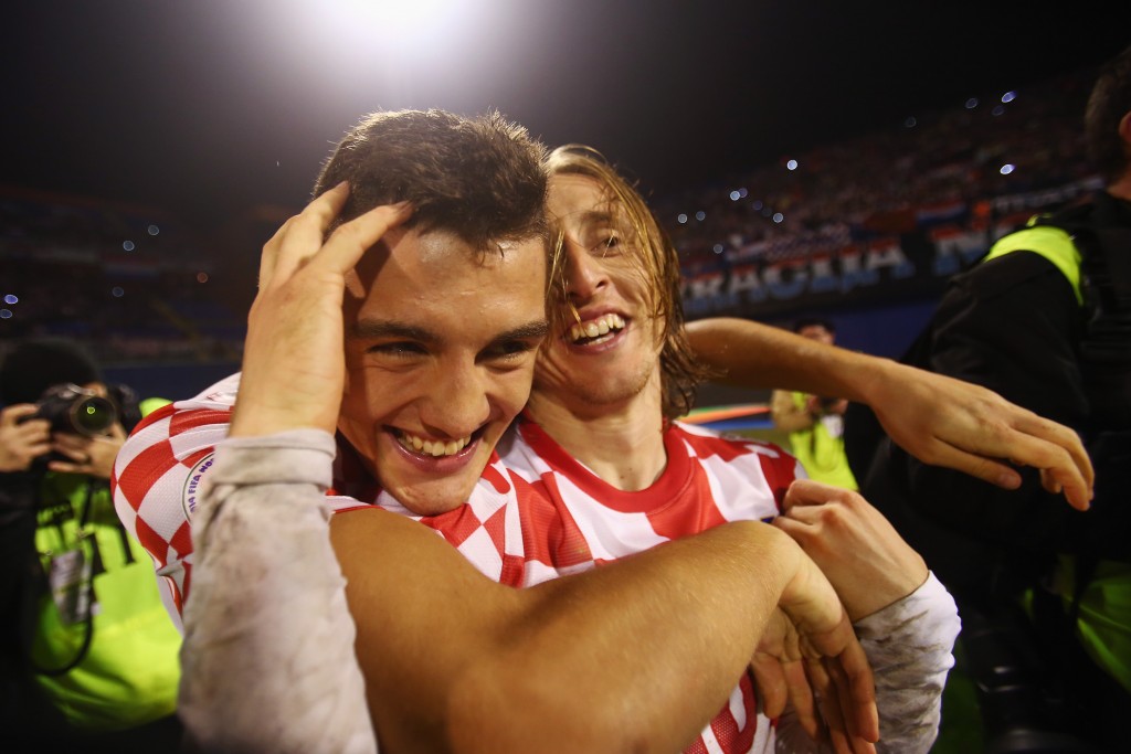 ZAGREB, CROATIA - NOVEMBER 19: Luka Modric (R) of Croatia celebrates with team mate Mateo Kovacic after the FIFA 2014 World Cup Qualifier play-off second leg match between Croatia and Iceland at Maksimir Stadium on November 19, 2013 in Zagreb, Croatia. (Photo by Alex Grimm/Getty Images)