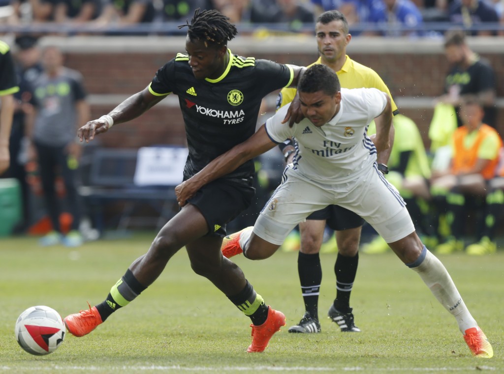 Real Madrid midfielder Carlos Henrique Casemiro (R) tries to steal the ball from Chelsea forward Michy Batshuayi (L) during an International Champions Cup soccer match in Ann Arbor, Michigan on July 30, 2016. / AFP / Jay LaPrete (Photo credit should read JAY LAPRETE/AFP/Getty Images)