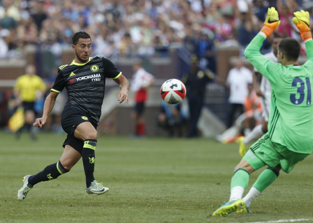 Chelsea midfielder Eden Hazard (L) shoots and scores against Real Madrid goalkeeper Ruben Yanez (R) during an International Champions Cup soccer match in Ann Arbor, Michigan on July 30, 2016. / AFP / Jay LaPrete (Photo credit should read JAY LAPRETE/AFP/Getty Images)