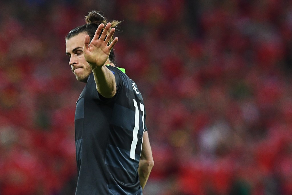 Wales' forward Gareth Bale reacts during the Euro 2016 semi-final football match between Portugal and Wales at the Parc Olympique Lyonnais stadium in Décines-Charpieu, near Lyon, on July 6, 2016. / AFP / Francisco LEONG (Photo credit should read FRANCISCO LEONG/AFP/Getty Images)