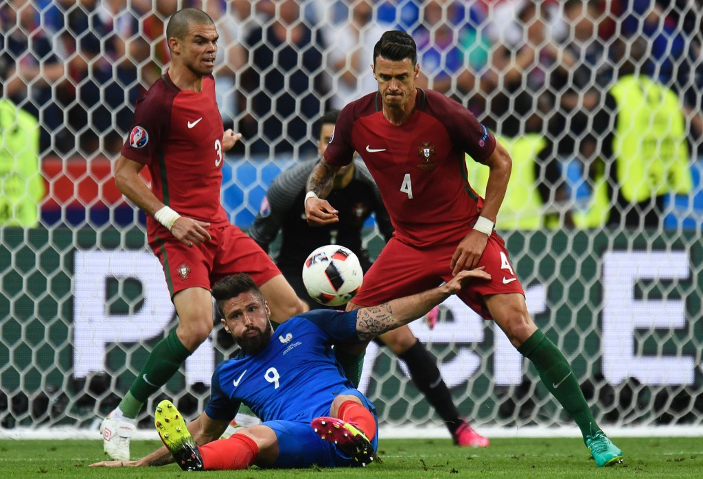 Portugal's defender Pepe (L) and Portugal's defender Fonte vie for the ball with France's forward Olivier Giroud during the Euro 2016 final football match between Portugal and France at the Stade de France in Saint-Denis, north of Paris, on July 10, 2016. / AFP / PHILIPPE DESMAZES (Photo credit should read PHILIPPE DESMAZES/AFP/Getty Images)