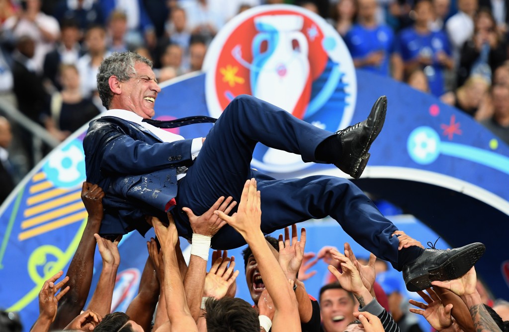 PARIS, FRANCE - JULY 10: Fernando Santos manager of Portugal is thrown into the air by his players after his side win 1-0 against France during the UEFA EURO 2016 Final match between Portugal and France at Stade de France on July 10, 2016 in Paris, France. (Photo by Laurence Griffiths/Getty Images)